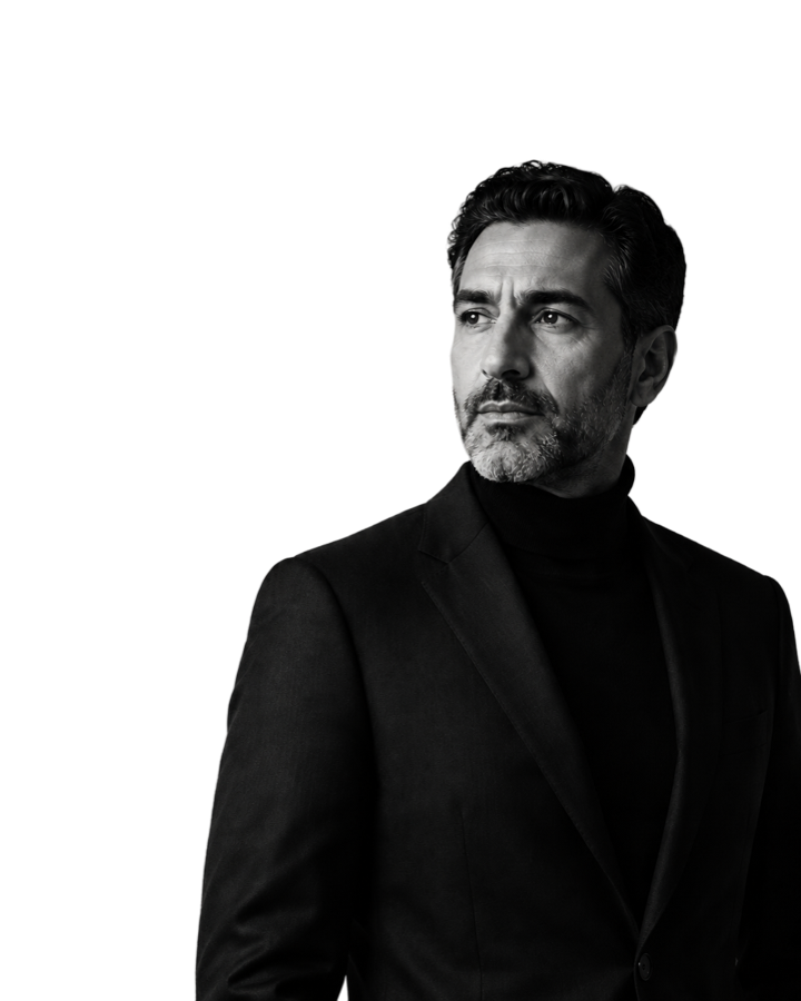 Arjun Mehta photographed against a dark background